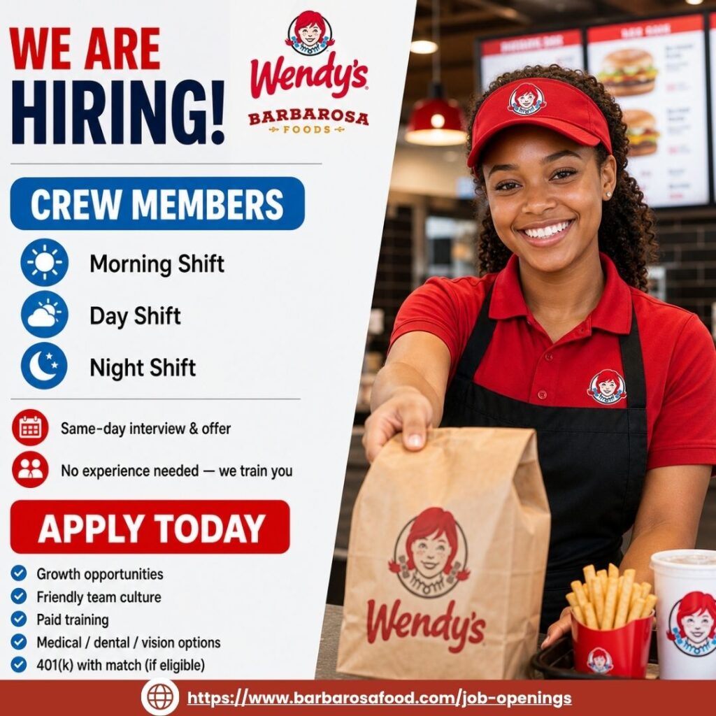 Smiling Wendy's crew member in red uniform and cap handing over a Wendy's takeout bag — Barbarosa Foods now hiring crew members with same-day interviews and paid training